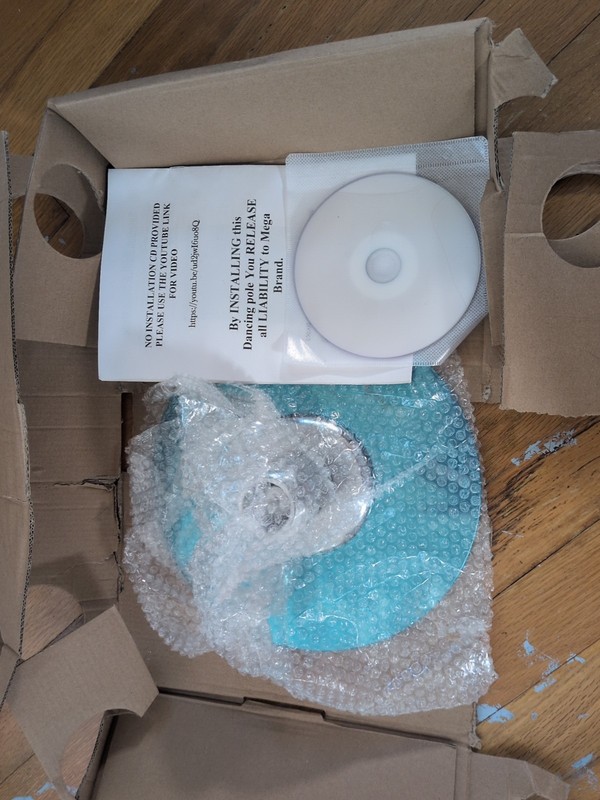 Dancing Pole. New, never removed from bubble wrap. Box destroyed. Tool missing. gallery